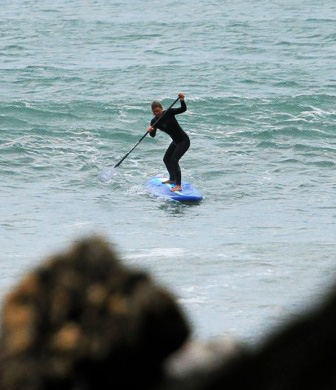 Paddling in surf stance