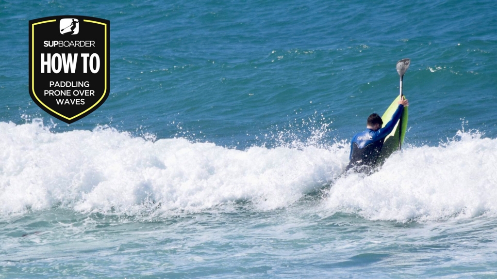 Prone paddling over waves with a SUP
